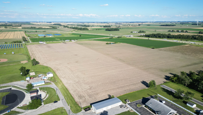 Aerial view of Antwerp fields with school track and buildings
